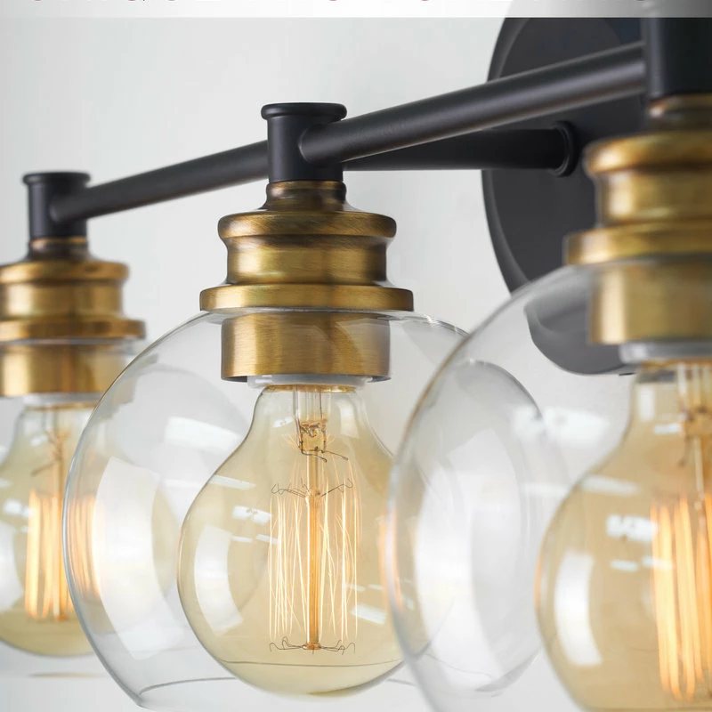 Kira Home Odette 22" Bathroom Light, Glass Globe Shades, Warm Brass Accents, Oil 4 Kira Home Odette 22" Bathroom Light, Glass Globe Shades, Warm Brass Accents, Oil - Image 4